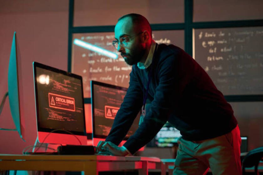 IT team analyzing cybersecurity threats and implementing data protection measures